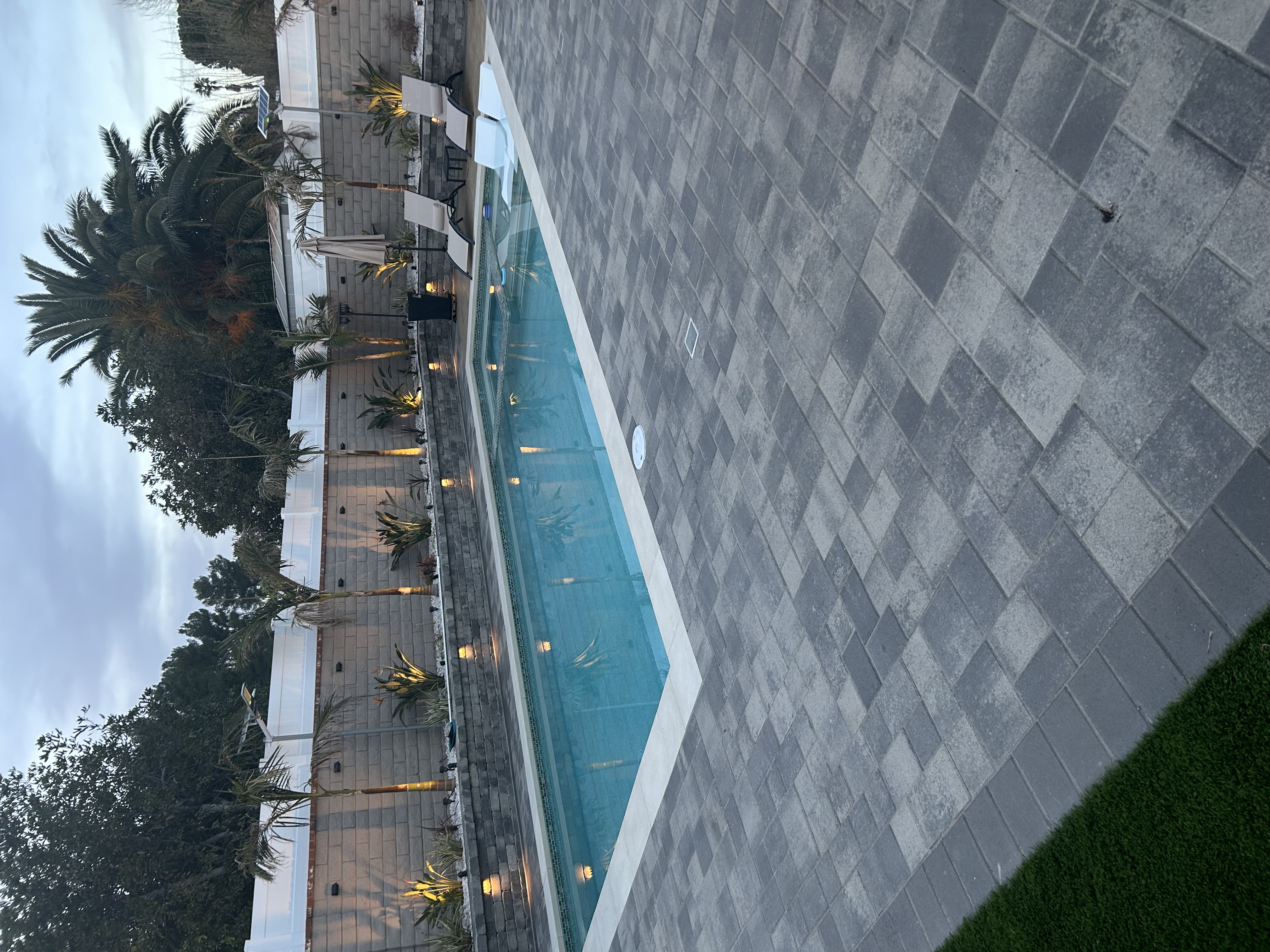 Pool with pavers and turf