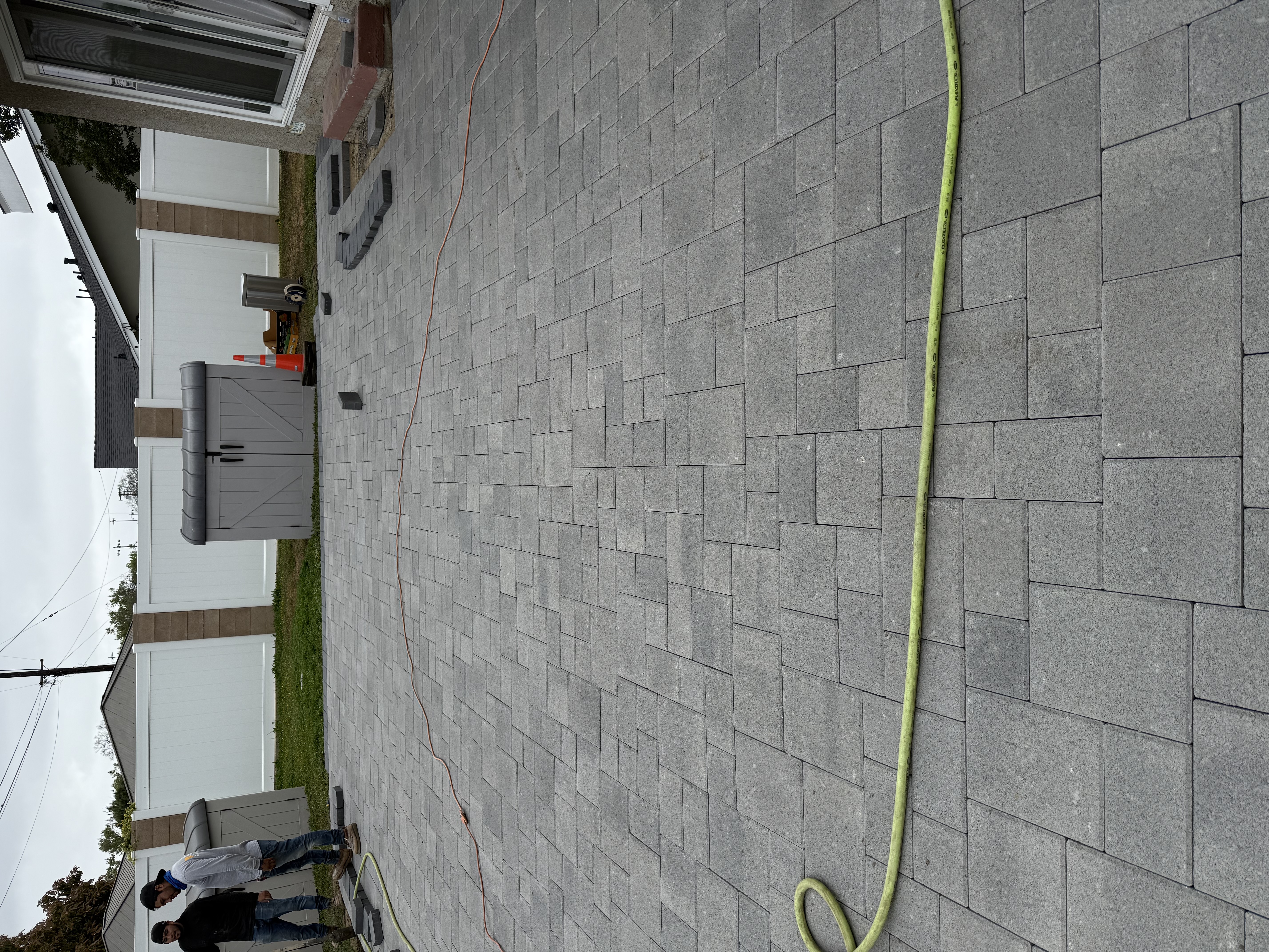 Gray paver driveway installation
