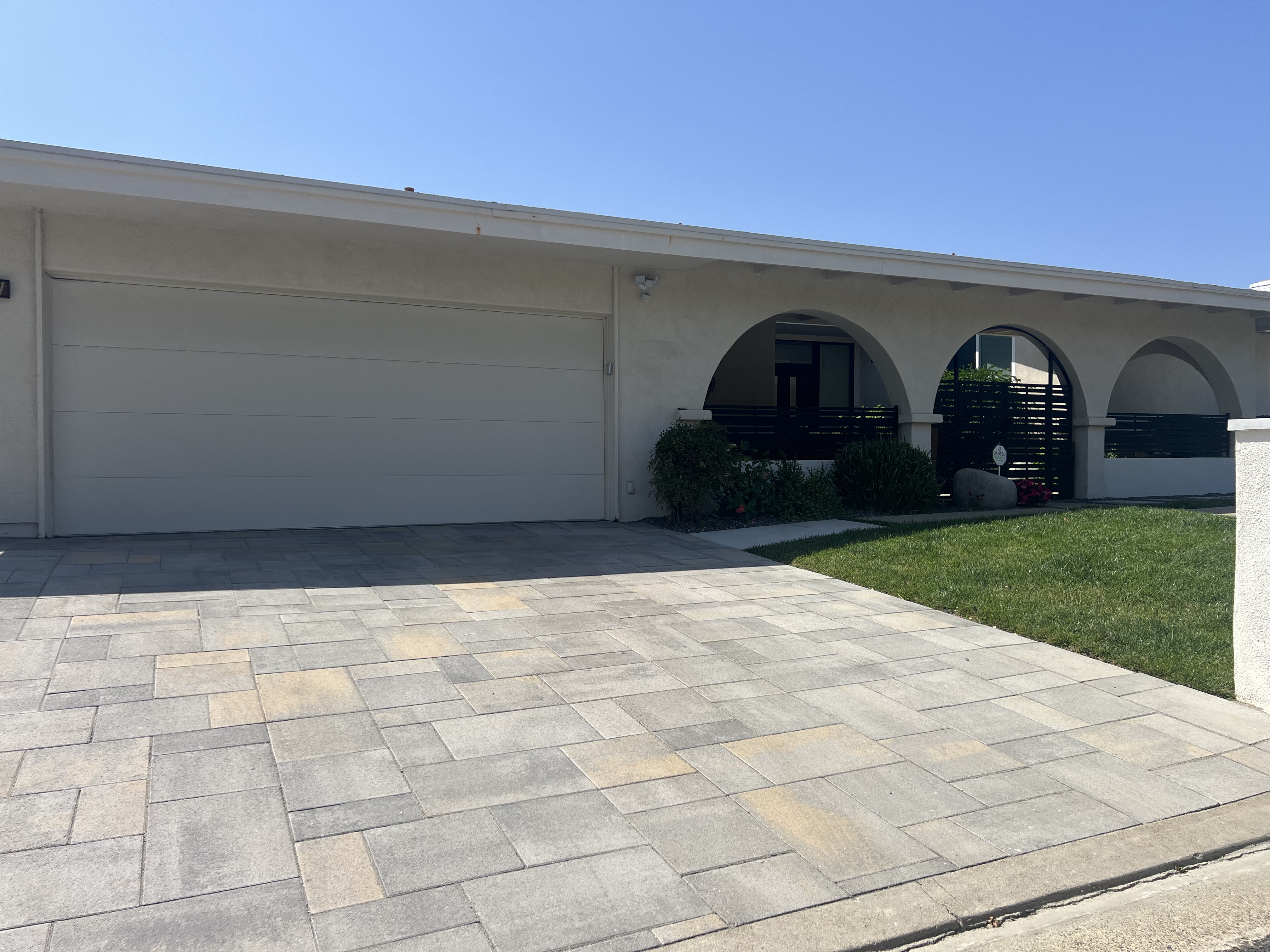 Paver driveway with blue sky